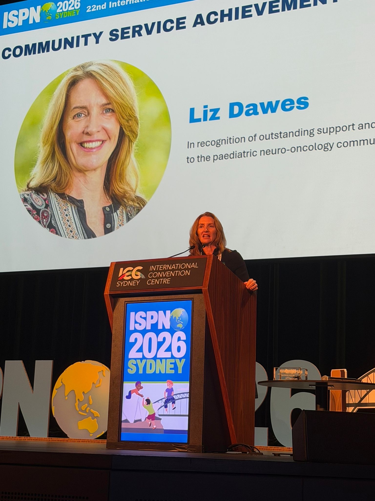 Liz Dawes OAM - RCDF CEO & Founder accepting her award at ISPNO